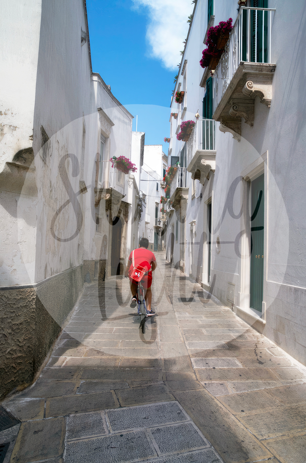 Red Bike Rider in Alley - Martina Franca, Puglia Italy